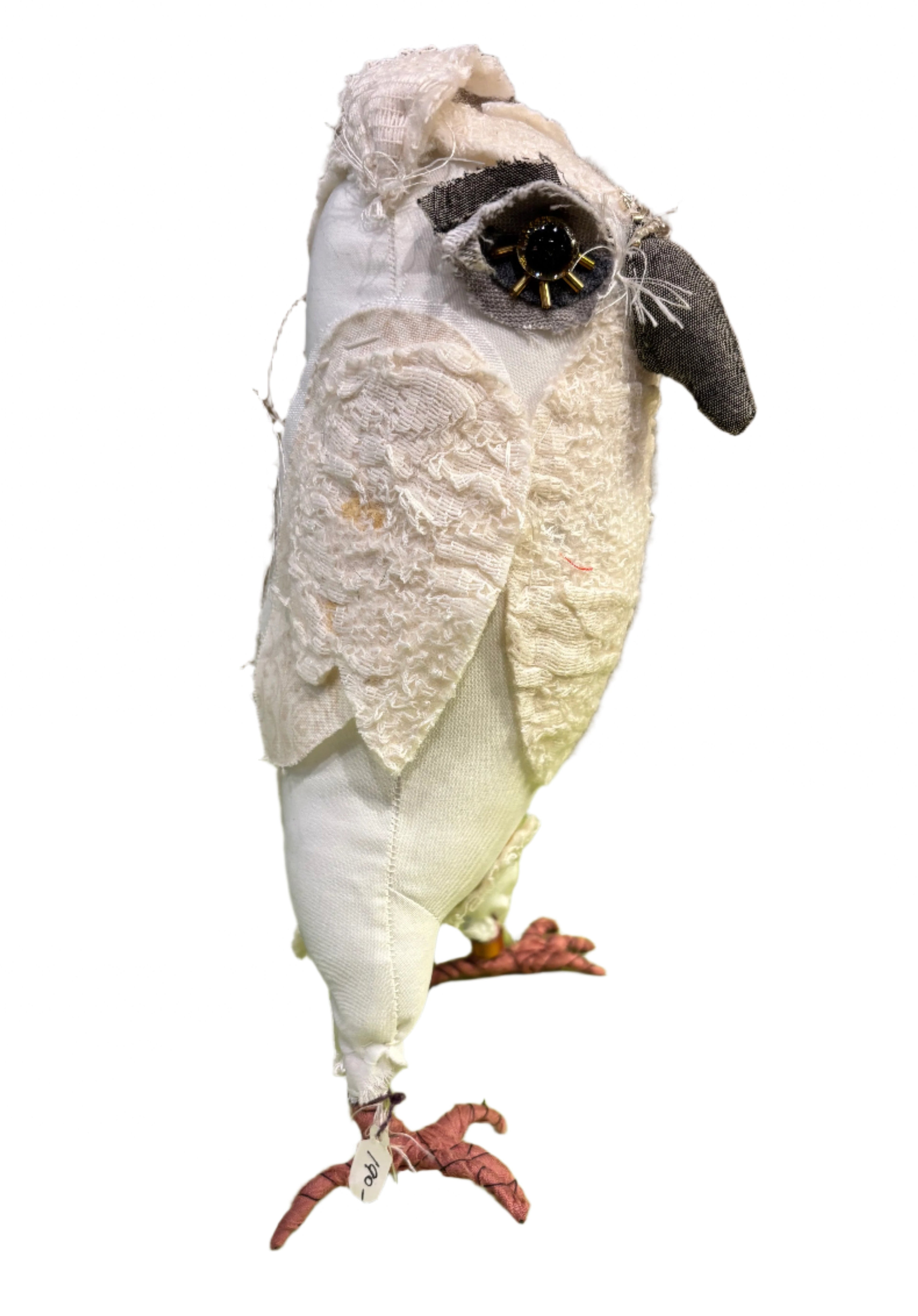 Hand made white fabric owl on a white background